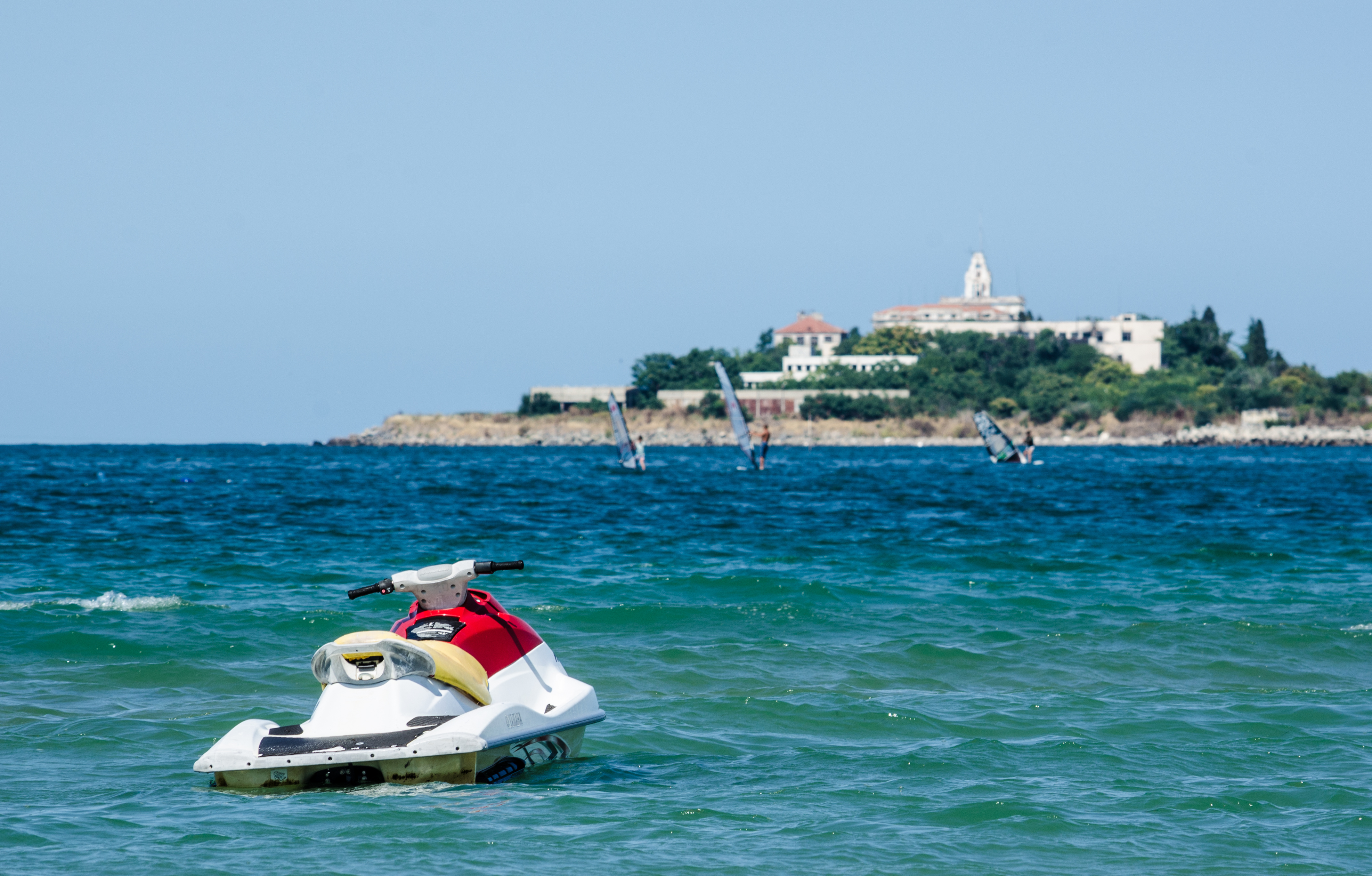Water scooter is floating on the black sea near a beach in bulgrian coastal town sozopol.
